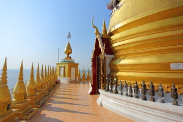 Gold pagoda and church located in the sea at Hong Thong Temple, Chachoengsao, Thailand