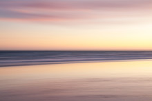 A Dreamy, Pink Coloured, Blurred Effect Of The Sea At Sunset At Brighton And Hove, East Sussex.