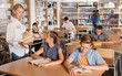 © JackF - Upset boy and girl sitting with books during lesson