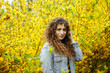 © Andrii - Curly girl in yellow colors. Spring. Botanical Garden.