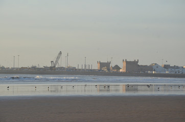 beautiful sunset at essaouira, morocco. essaouira is a port city and resort on morocco’s atlantic co