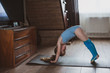 © Kiryakova Anna - The girl does gymnastics at home. Gymnastics video tutorial. Gymnastic exercises. The idea for a children's activity in quarantine