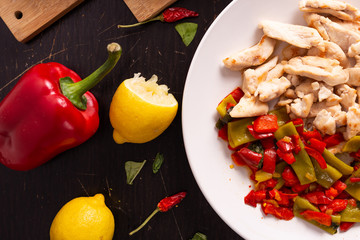 Wall Mural - Chicken nuggets with lemon and mix vegetables. Low fat protein lunch, fast lunch. View from the top.