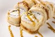 © Maxim - Eel rolls with avocado, sauce on a plate close up