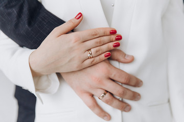 Wedding. Bride and groom holding hands