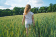 © photographmd - girl walking away in field