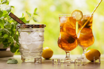 Wall Mural - Iced tea with lemon and ice cubes