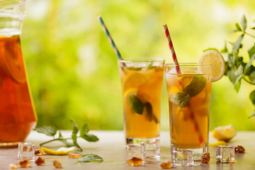 Wall Mural - Iced tea with lemon and ice cubes