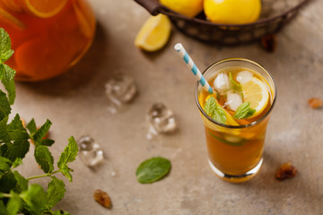 Wall Mural - Iced tea with lemon and ice cubes