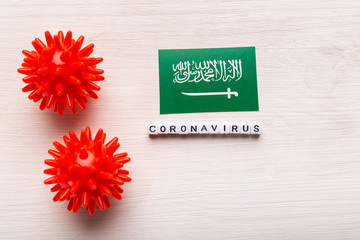 Coronavirus attack concept. Saudi Arabia fight against covid-19. Concept how coronavirus attack on saudi arabia on white background top view.