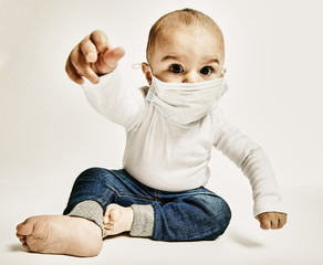 Wall Mural - Portrait of a baby boy with a mask on his face