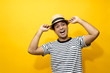 © methaphum - Photo of young excited man happy positive smile yellow background
