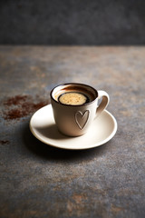 Wall Mural - Cup of black coffee on rustic background. Copy space