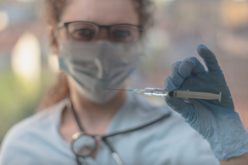 Wall Mural - young doctor with syringe