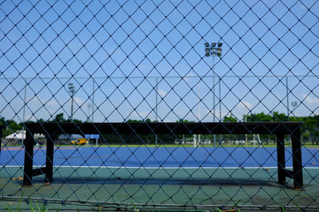 Wooden Bench Seat in Futsal Court Background.