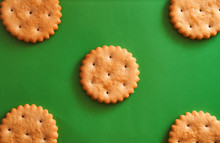 Round Cracker On A Green Background