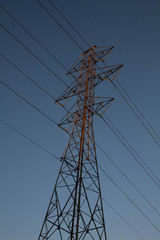 Power lines against blue sky