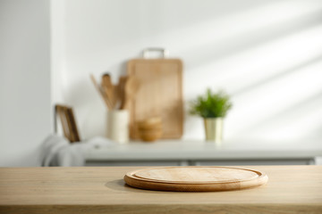 Wall Mural - table background of free space and kitchen interior with white wall and shadows.copy space for your 