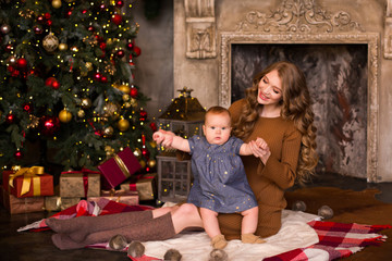 Wall Mural - Mother with daughter near xmas tree