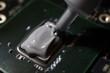 Applying thermal paste to the processor microchip.