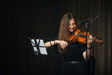 Classical Musician Playing The Violin On Stage