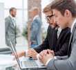 © ASDF - close up. business colleagues work on a laptop in the office