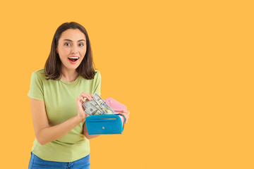 Sticker - Young woman with wallet on color background