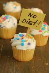 Poster - No diet sign on vanilla cupcakes with candies