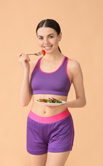 Sticker - Young woman with salad on color background. Weight loss concept