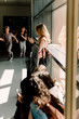 © Maskot - Female students in school corridor during lunch break