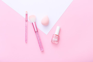 Sticker - Female tools and makeup accessories on pink and white background.