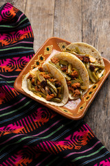 Mexican chorizo with nopal cactus tacos on wooden background