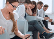 © ASDF - in the foreground.a young business woman is waiting for an interview
