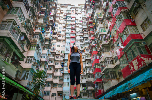 Traveler Exploring Densely Populated Housing Apartments in Hong Kong Wallpaper Mural