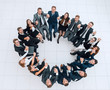 © ASDF - concept of team building .large successful business team sitting in a circle