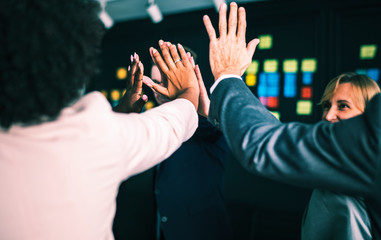 Wall Mural - Business team giving a high five