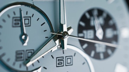 Hand watch face with details and texture. Very close. Arrow running in extreme macro close up of business clock front, seconds hand.