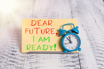 Wall Mural - Word writing text Dear Future I Am Ready. Business photo showcasing Confident to move ahead or to face the future Mini blue alarm clock stand tilted above buffer wire in front of notepaper