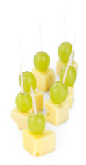 Canvas Print - Cheese blocks with grapes isolated on white