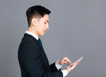  Young Business Man Using The Digital Tablet
