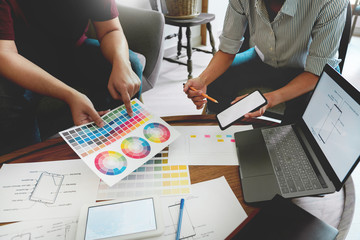 Wall Mural - Creative team analyzing prototype products for product design in Coworking Space, teamwork collaboration concept.