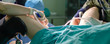 Surgeon doctor in operating room during gynecological biopsy