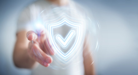 Fototapete - Man using digital shield protection blue holographic interface 3D rendering