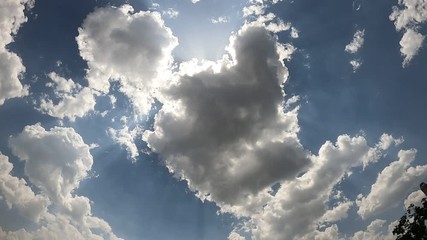 time lapse of sun coming out of the clouds.