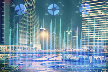 Financial chart on city scape with tall buildings background multi exposure. Analysis concept.