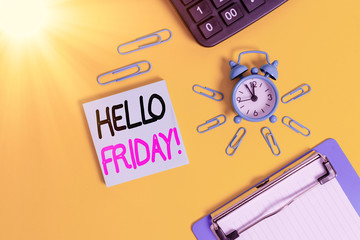 Wall Mural - Conceptual hand writing showing Hello Friday. Concept meaning you say this for wishing and hoping another good lovely week Alarm clock clipboard clips calculator notepad colored background