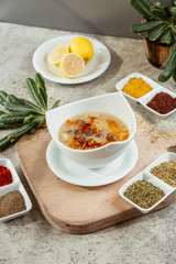 Canvas Print - soup served with different spices and herbs