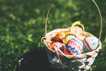 Painted Easter Eggs In Wicker Basket.