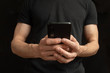© Andrew - close view of thin male hands holding a phone