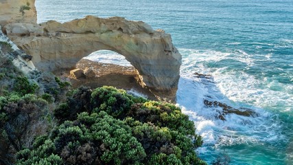 Wall Mural - The Arch. A natural rock arch with waves crashing. A popular stop on the Great Ocean Road. Tourist attraction in Port Campbell Victoria Australia.